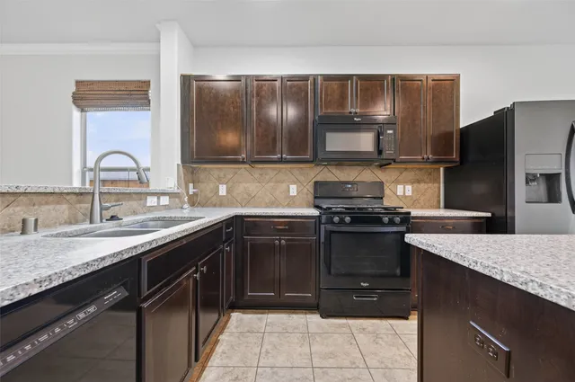 a bathroom with a sink vanity and a toilet