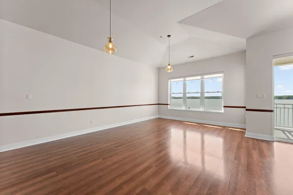 a view of a kitchen with wooden floor