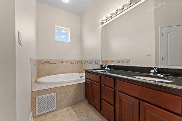 a room with a sink and cabinets