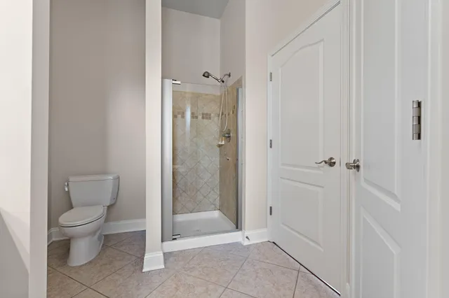 a view of a room with wooden floor and window