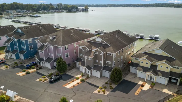 an aerial view of a house with a lake view