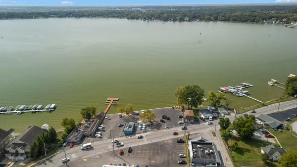 an aerial view of a house with a lake view