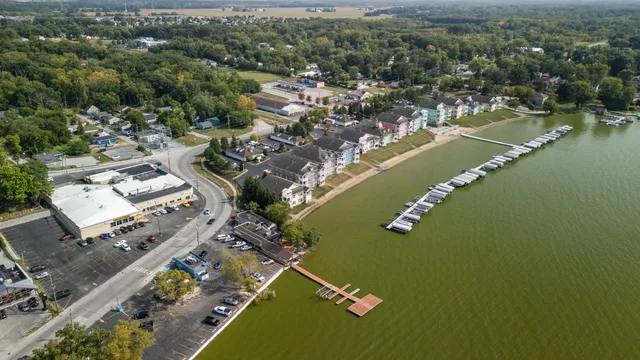 an aerial view of a house with swimming pool and outdoor space