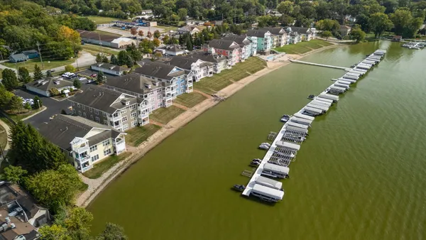 an aerial view of a house with a lake view