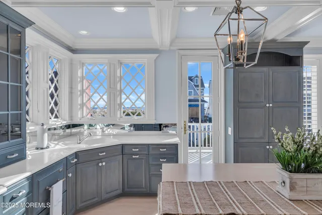 a kitchen with a sink dishwasher a refrigerator and a granite counter tops