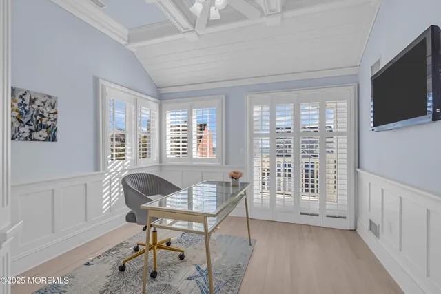 a view of a livingroom with furniture and a window