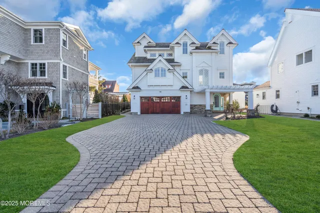 a view of a big building with a big yard and large trees