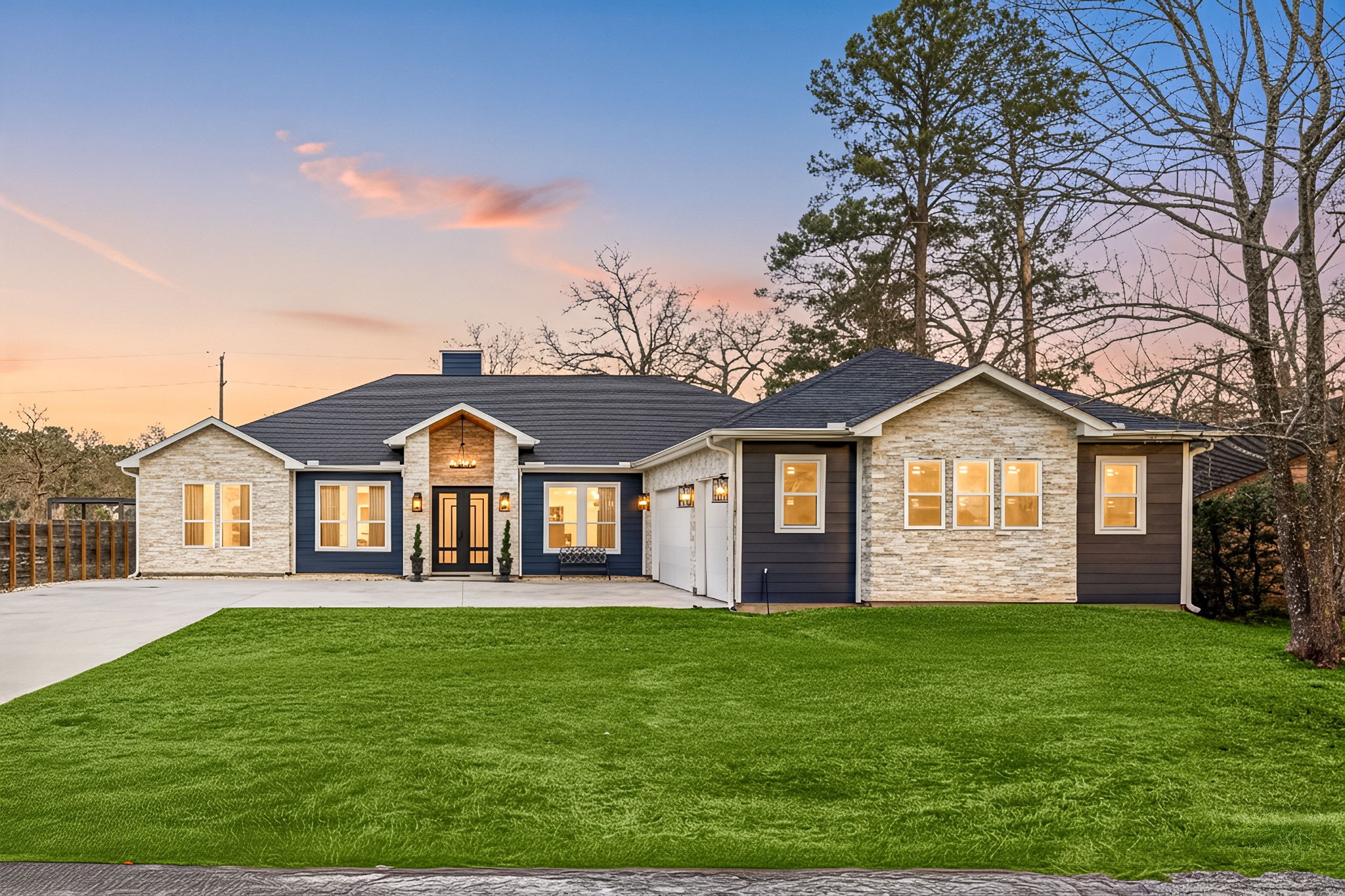 a front view of a house with a garden and yard