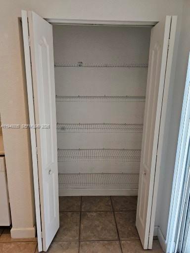 2160 Northeast 37th Road, Unit 2160 Homestead, FL 33033 - Photo 17 of 47 a view of a room with rack on the wall