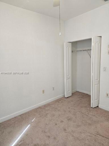 2160 Northeast 37th Road, Unit 2160 Homestead, FL 33033 - Photo 46 of 47 an empty room with closet and a hallway