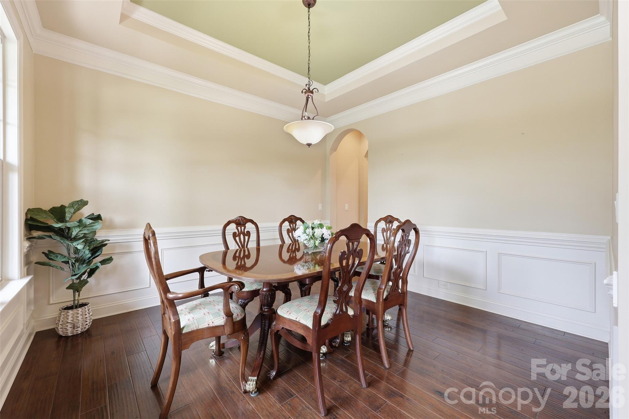 8094 Clems Branch Road Indian Land, SC 29707 - Photo 10 of 38 a dining room with furniture and a chandelier