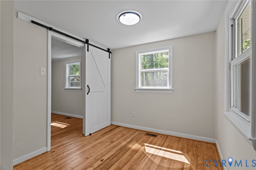 67 Deer Drive Gum Spring, VA 23065 - Photo 11 of 25 Barn Door Entry into Bedroom