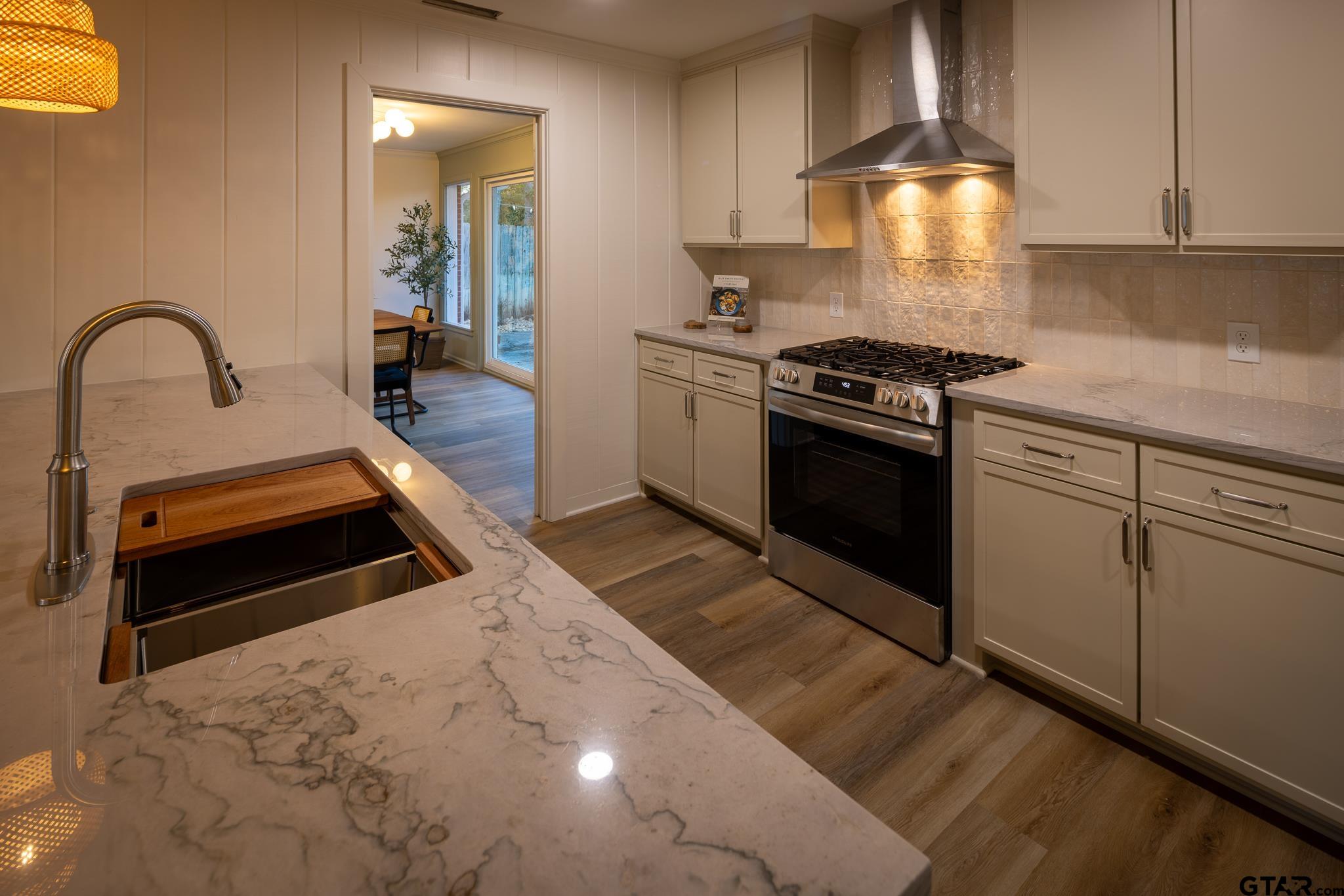 3518 Bain Place Tyler, TX 75701 - Photo 12 of 44 a kitchen with a stove and a sink
