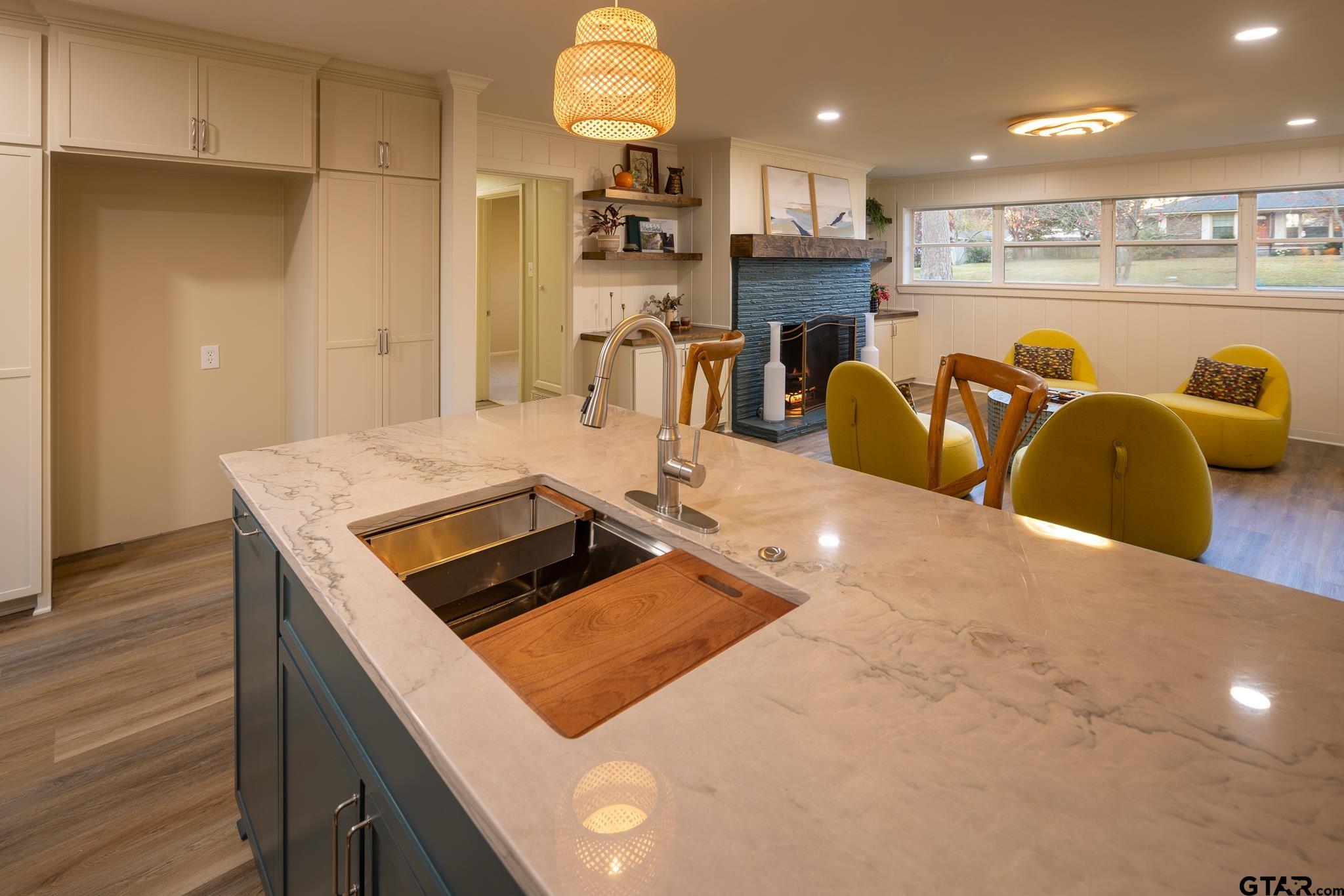 3518 Bain Place Tyler, TX 75701 - Photo 17 of 44 a kitchen with stainless steel appliances granite countertop a sink a refrigerator and a stove