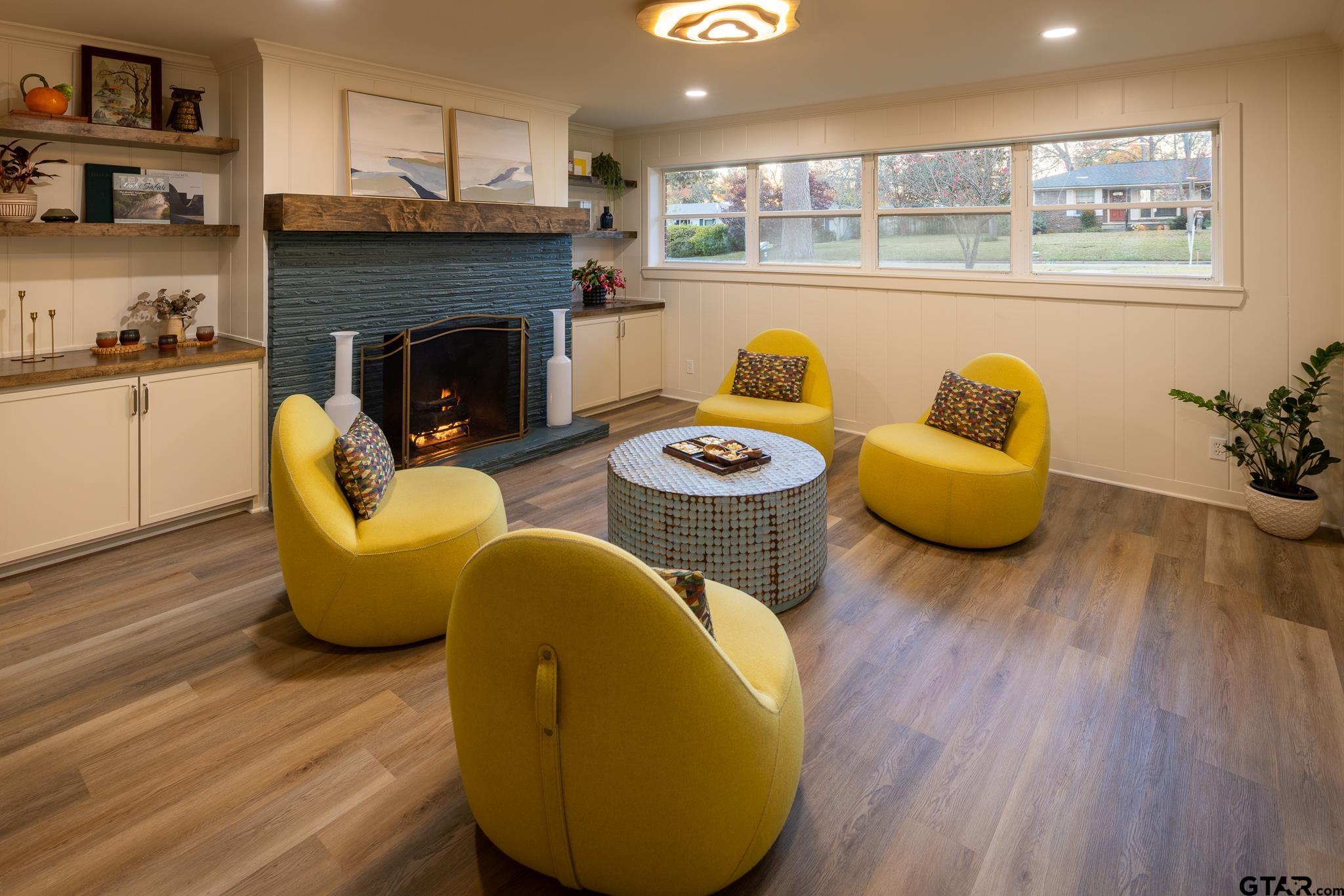 3518 Bain Place Tyler, TX 75701 - Photo 19 of 44 a living room with furniture and a fireplace