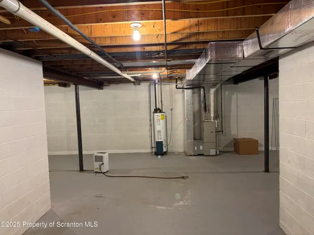 a view of empty room with wooden walls