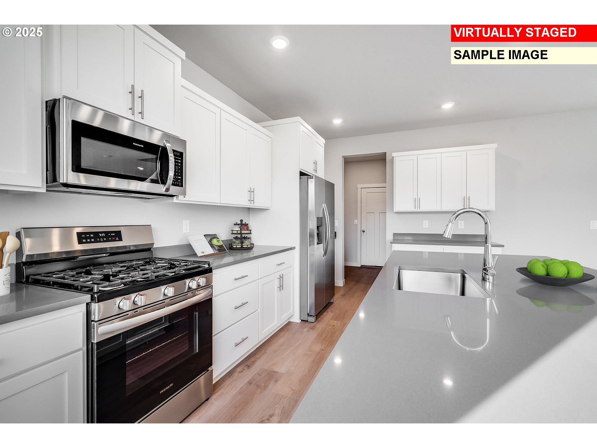 843 Glade Avenue, Unit H162 Forest Grove, OR 97116 - Photo 13 of 28 a kitchen with stainless steel appliances a stove microwave and sink