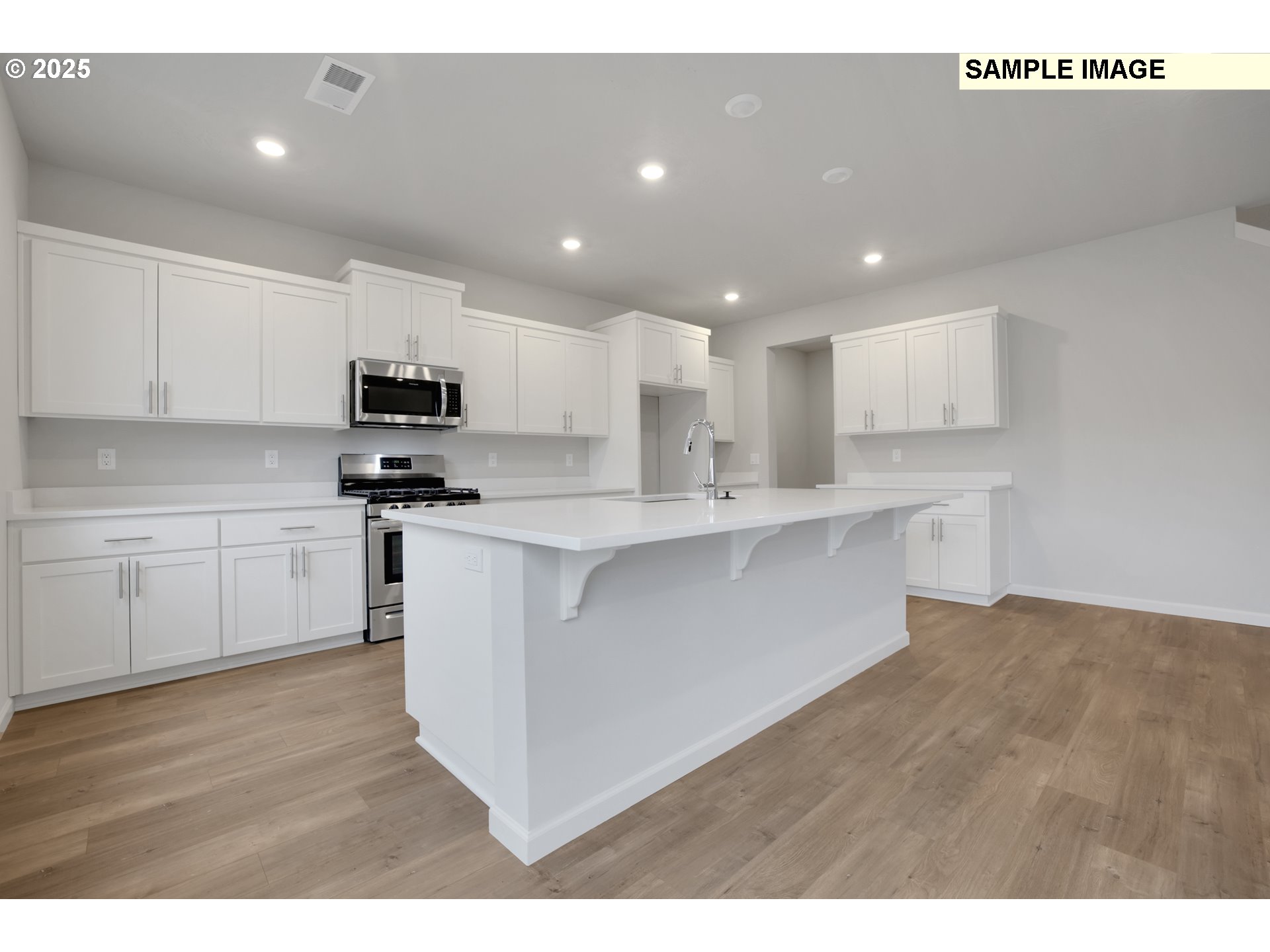 843 Glade Avenue, Unit H162 Forest Grove, OR 97116 - Photo 23 of 28 a kitchen with stainless steel appliances a sink a stove a microwave a refrigerator a white cabinets and wooden floor
