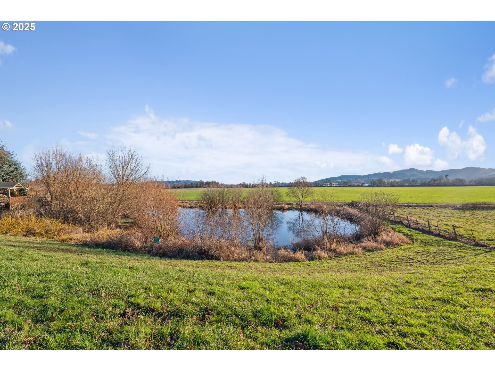 843 Glade Avenue, Unit H162 Forest Grove, OR 97116 - Photo 26 of 28 a view of a lake with a big yard
