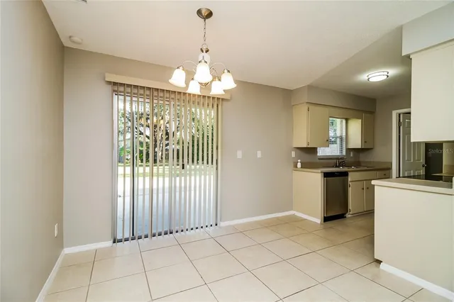 a kitchen with a sink cabinets and window