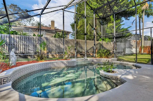 a kitchen with granite countertop a sink and cabinets