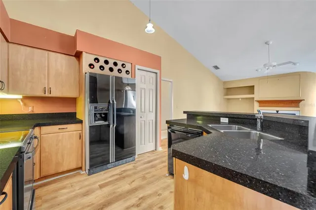 a view of livingroom with hardwood floor and a ceiling fan