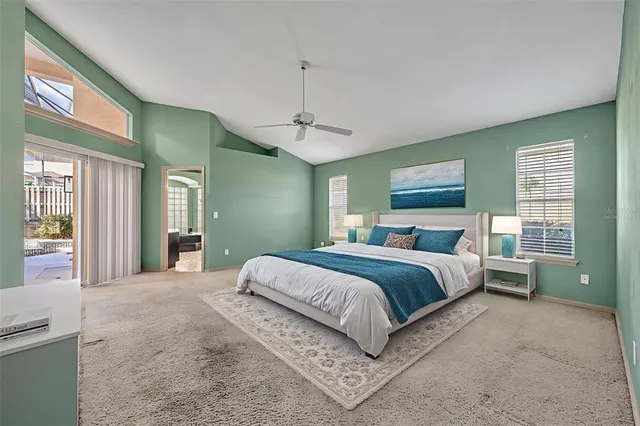 an empty room with a ceiling fan and window