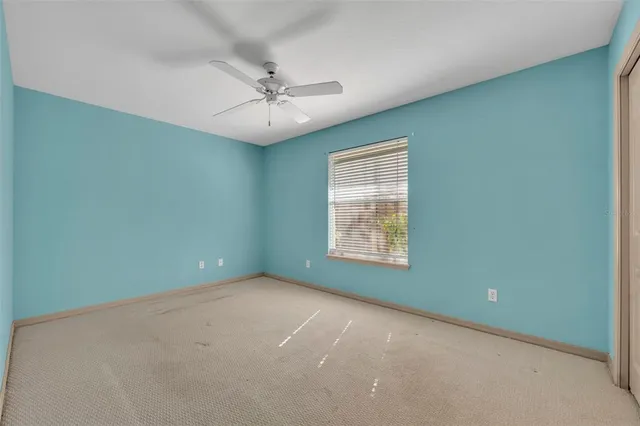 an aerial view of a house with a yard and a fountain