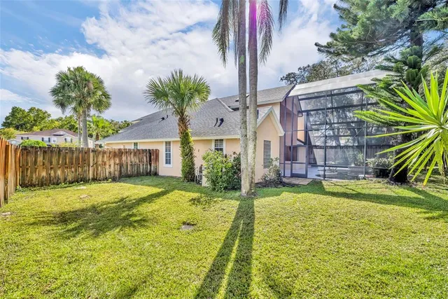 an aerial view of a house with outdoor space
