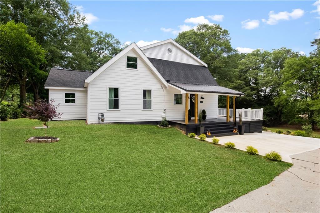 13410 Hopewell Road Milton, GA 30004 - Photo 1 of 1 a view of a house with a yard