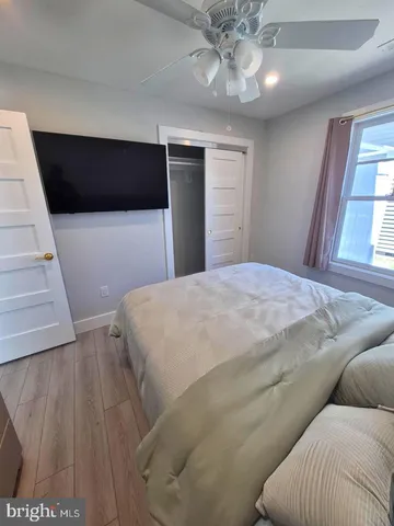 a bedroom with a bed and window