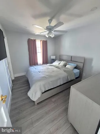 a bedroom with bed and window