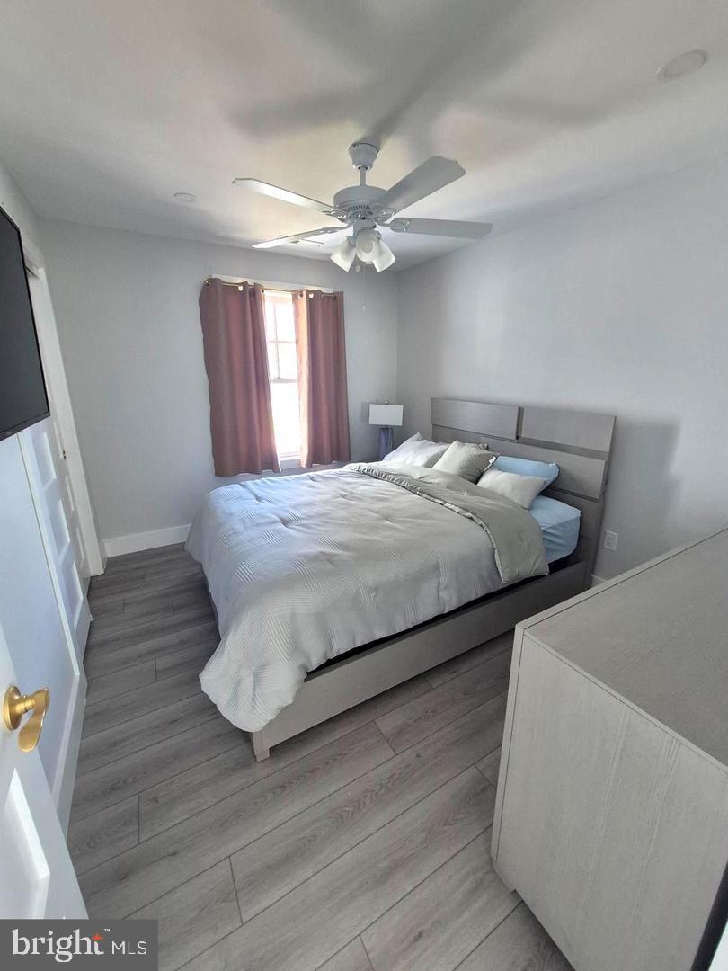 157 Old Wharf Road Ocean City, MD 21842 - Photo 15 of 27 a bedroom with bed and window
