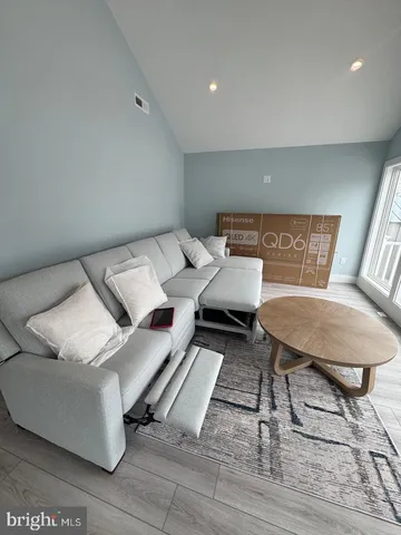 a bed room with a bed and a chair