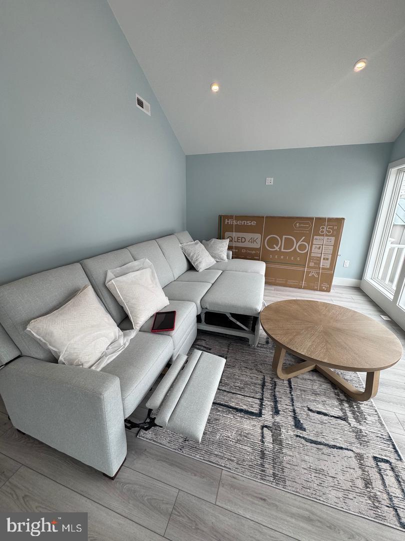 157 Old Wharf Road Ocean City, MD 21842 - Photo 19 of 27 a bed room with a bed and a chair