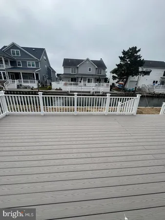 a view of balcony with cars