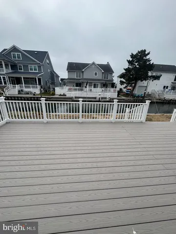 a view of balcony with cars