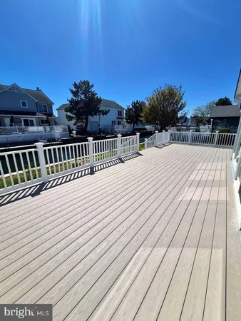 a view of balcony with wooden floor and city view