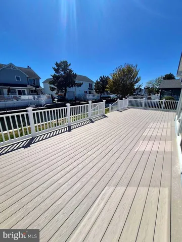 a view of balcony with wooden floor and city view