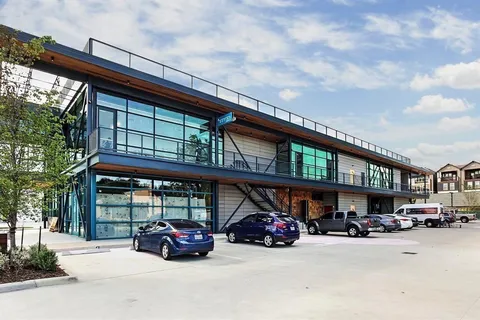 a view of a car parked in front of a building