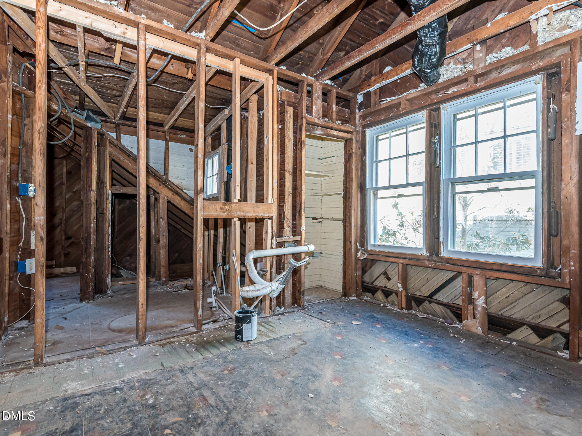 1825 White Oak Road Raleigh, NC 27608 - Photo 19 of 35 a view of an empty room with windows