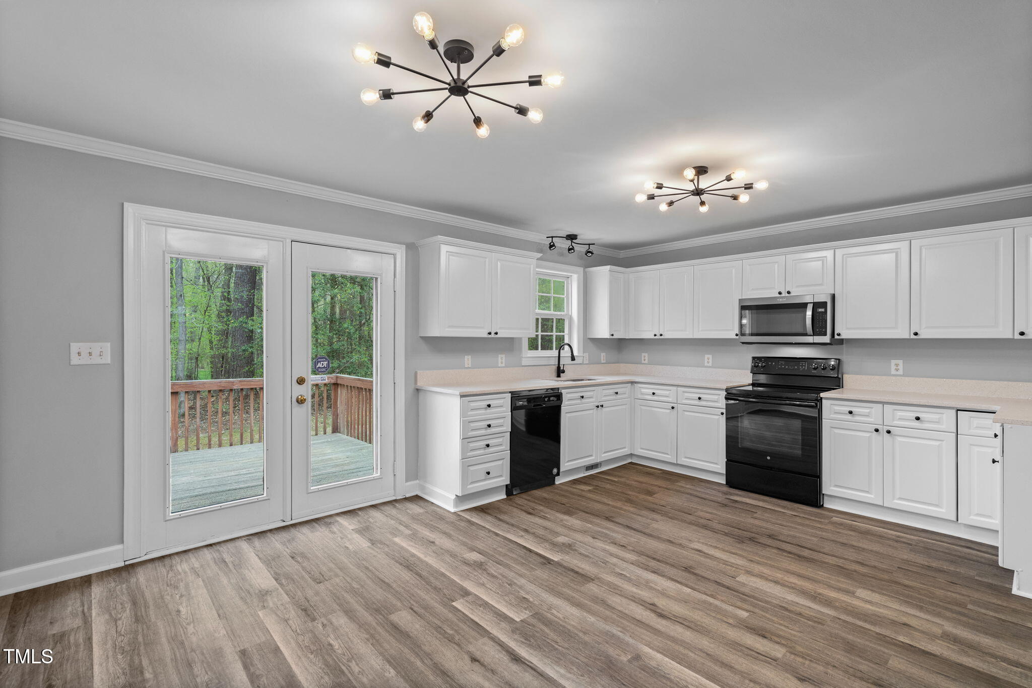 340 Castleberry Road Clayton, NC 27527 - Photo 10 of 31 a kitchen with a stove a sink and a refrigerator
