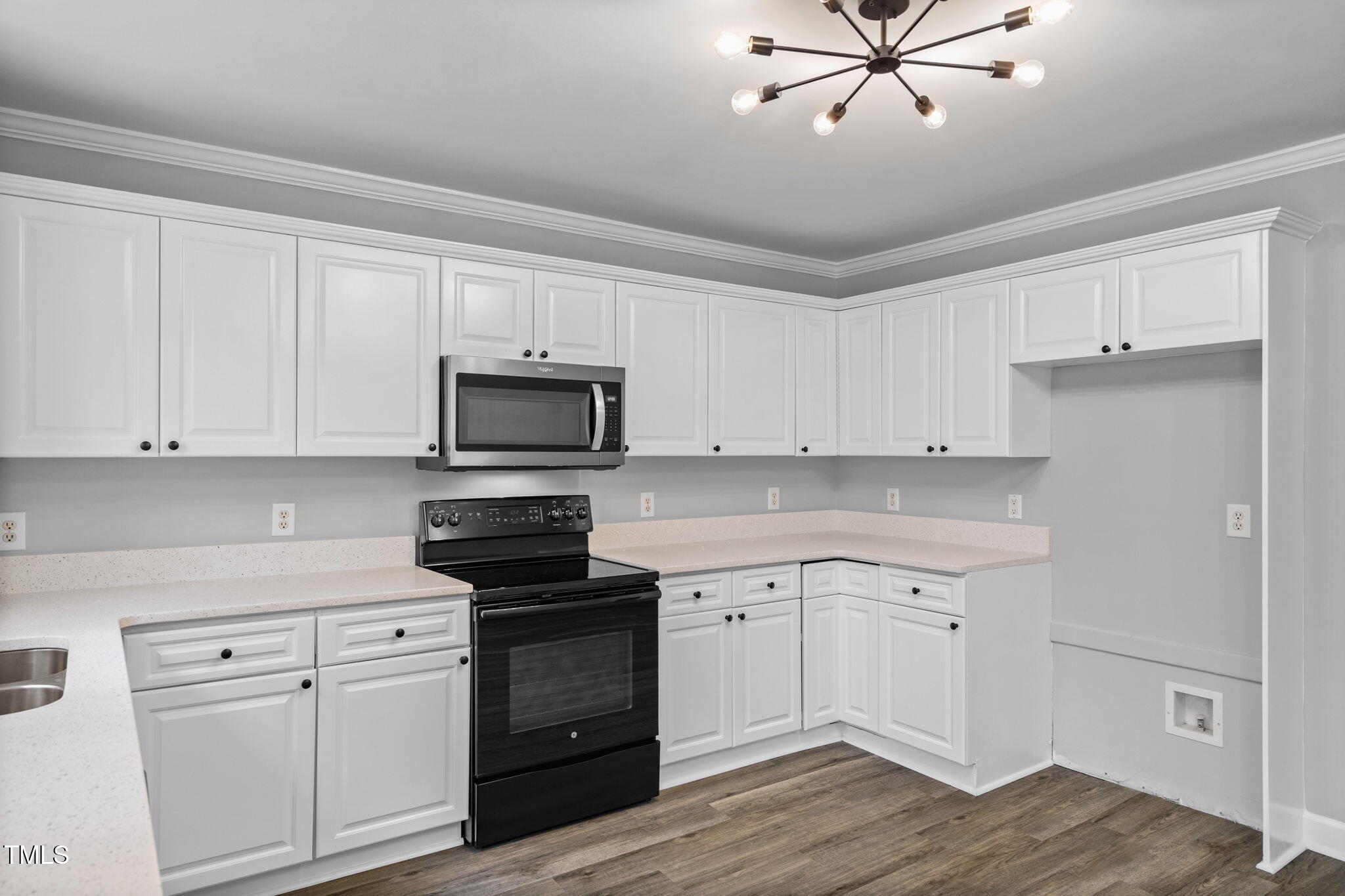 340 Castleberry Road Clayton, NC 27527 - Photo 12 of 31 a kitchen with white cabinets stainless steel appliances and sink