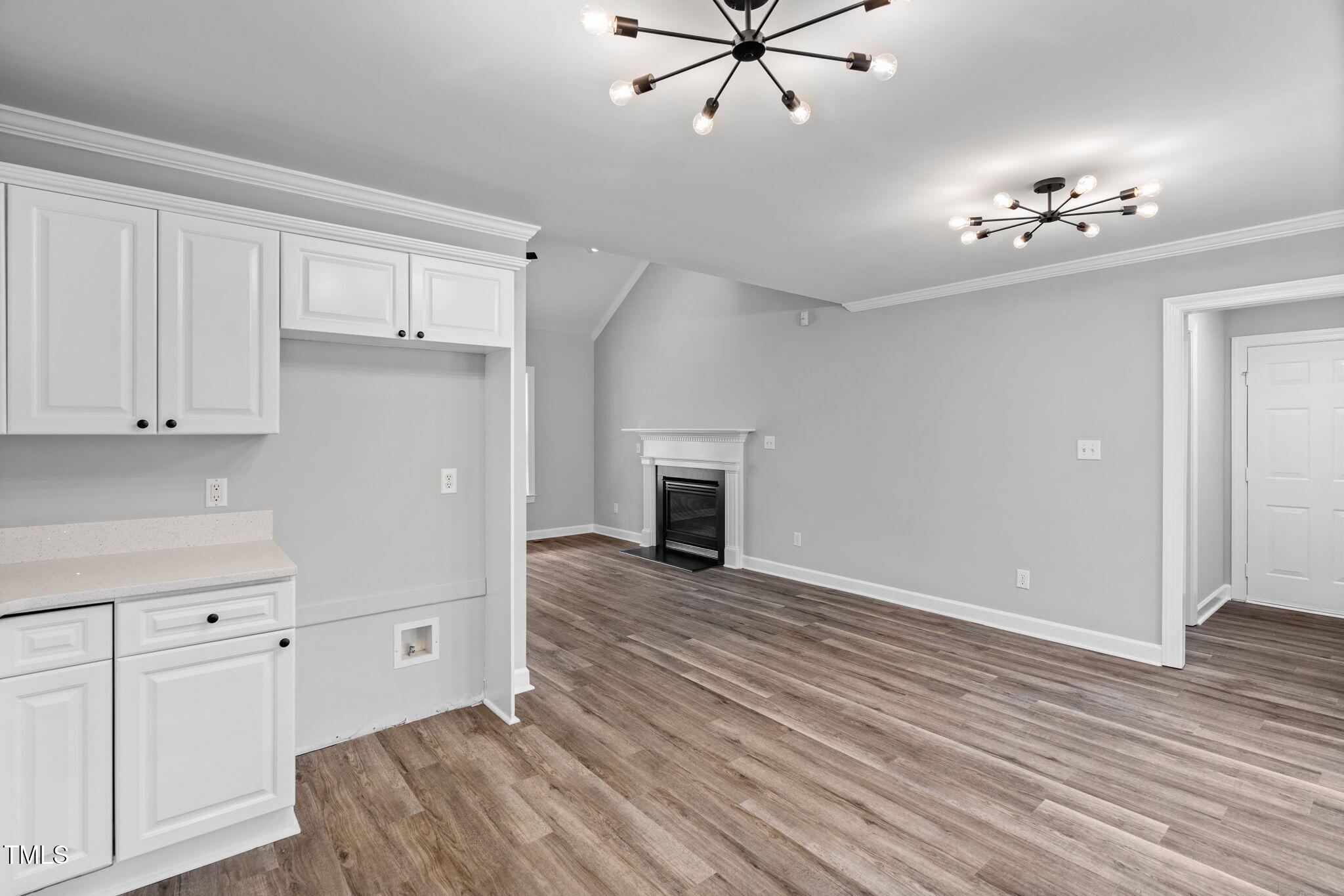 340 Castleberry Road Clayton, NC 27527 - Photo 13 of 31 a view of a livingroom with hardwood floor and cabinet
