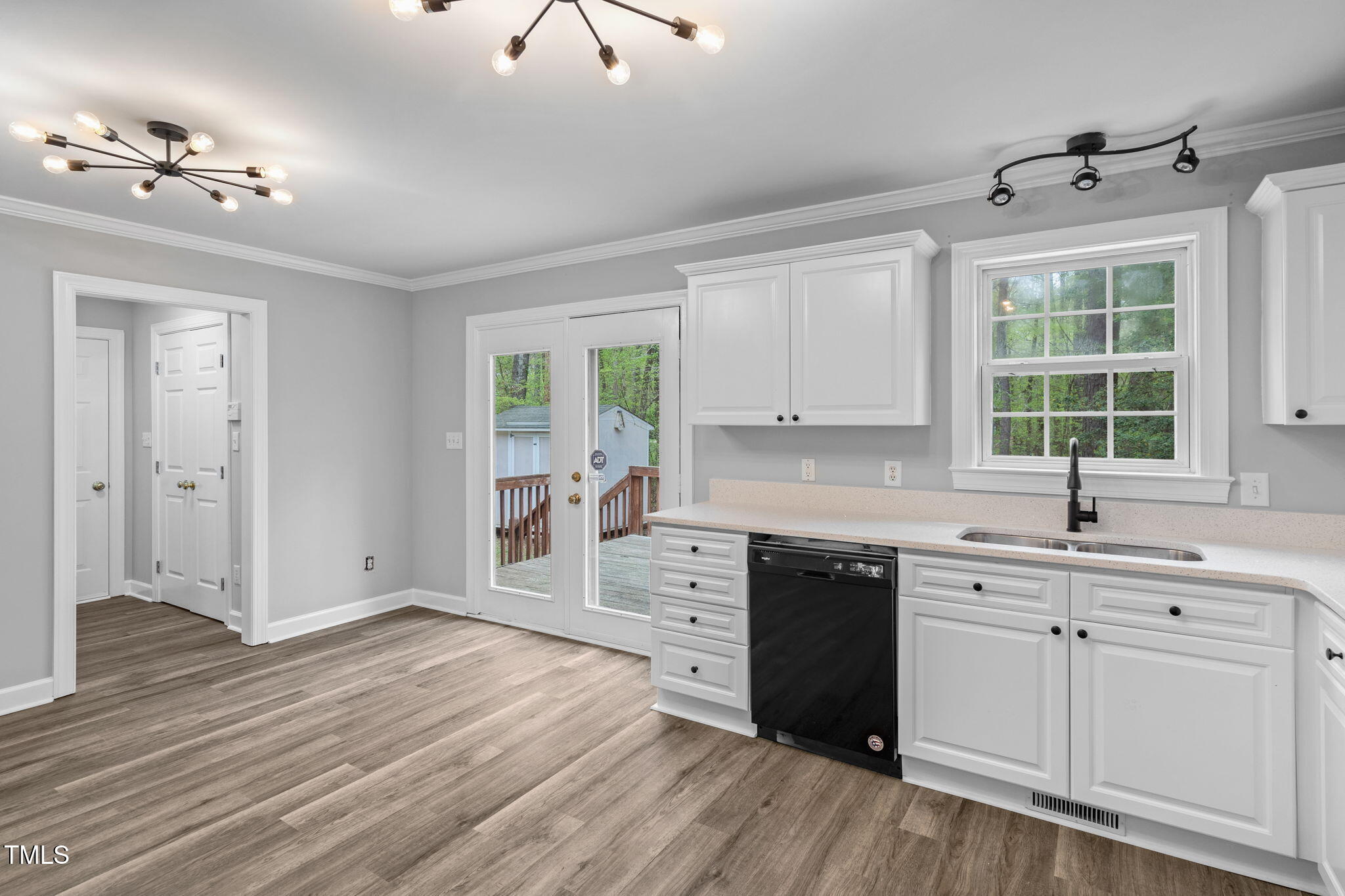 340 Castleberry Road Clayton, NC 27527 - Photo 14 of 31 a kitchen with a sink cabinets and wooden floor