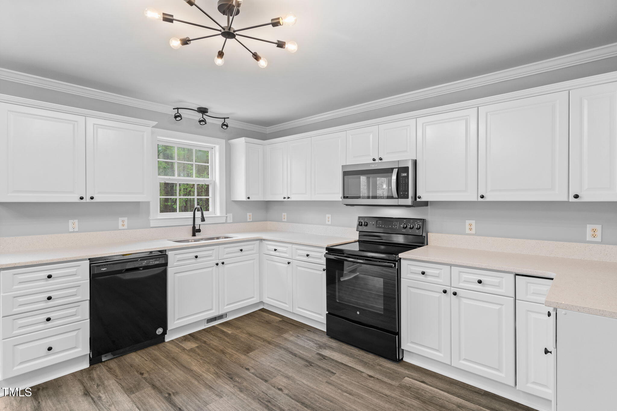 340 Castleberry Road Clayton, NC 27527 - Photo 15 of 31 a kitchen with granite countertop cabinets stainless steel appliances and a window