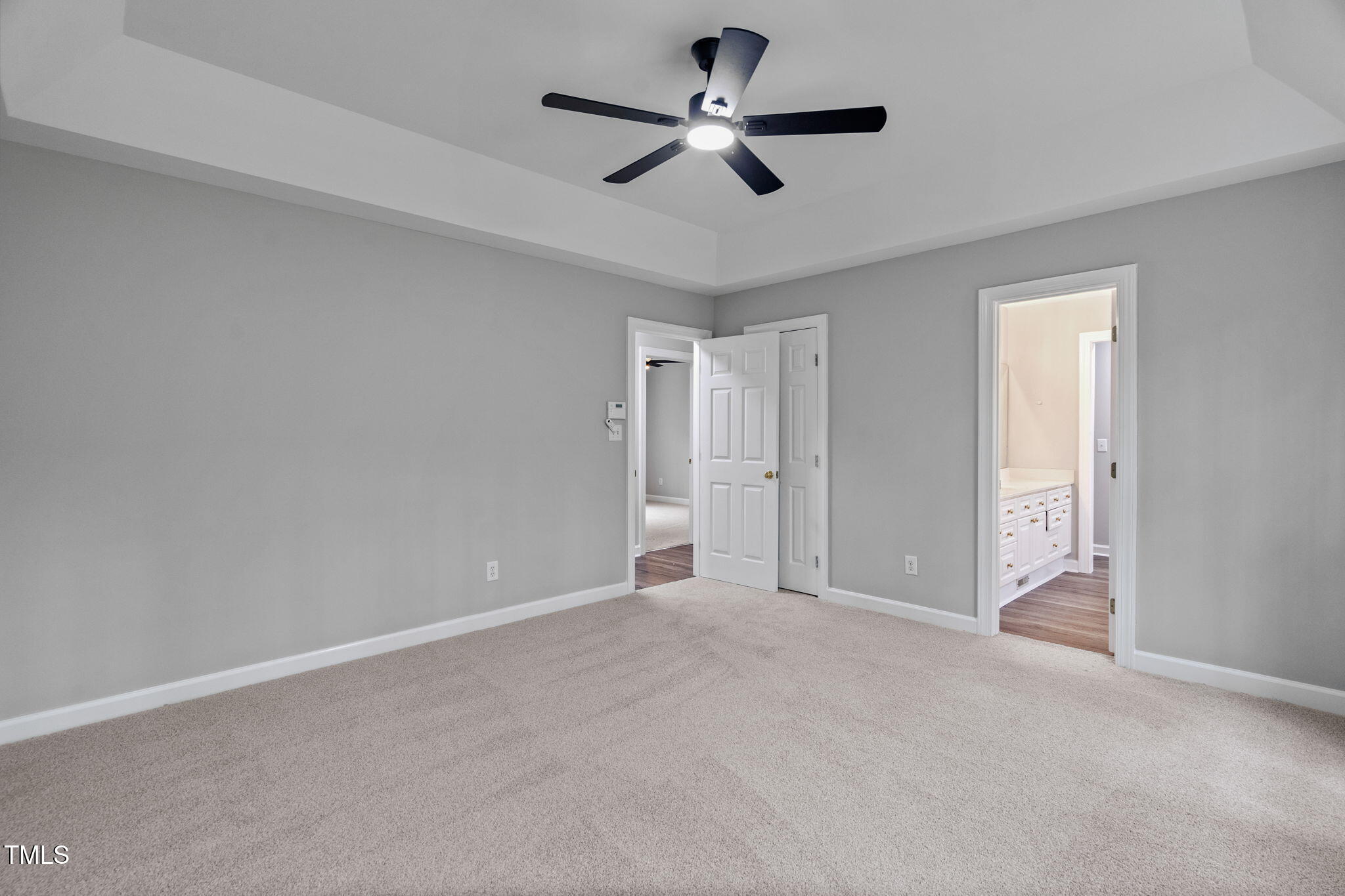 340 Castleberry Road Clayton, NC 27527 - Photo 17 of 31 a view of an empty room and chandelier fan