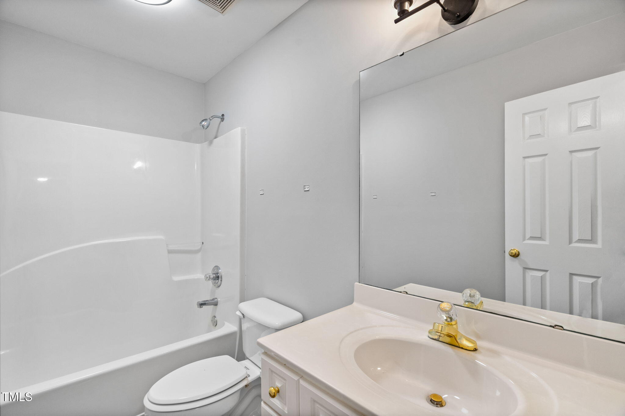 340 Castleberry Road Clayton, NC 27527 - Photo 22 of 31 a bathroom with a sink toilet and shower