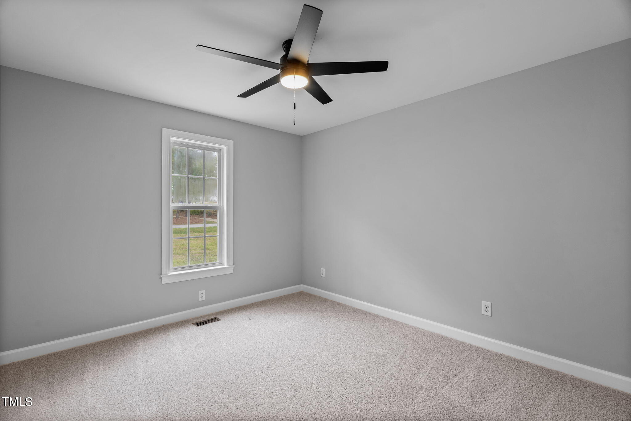 340 Castleberry Road Clayton, NC 27527 - Photo 23 of 31 an empty room with a window