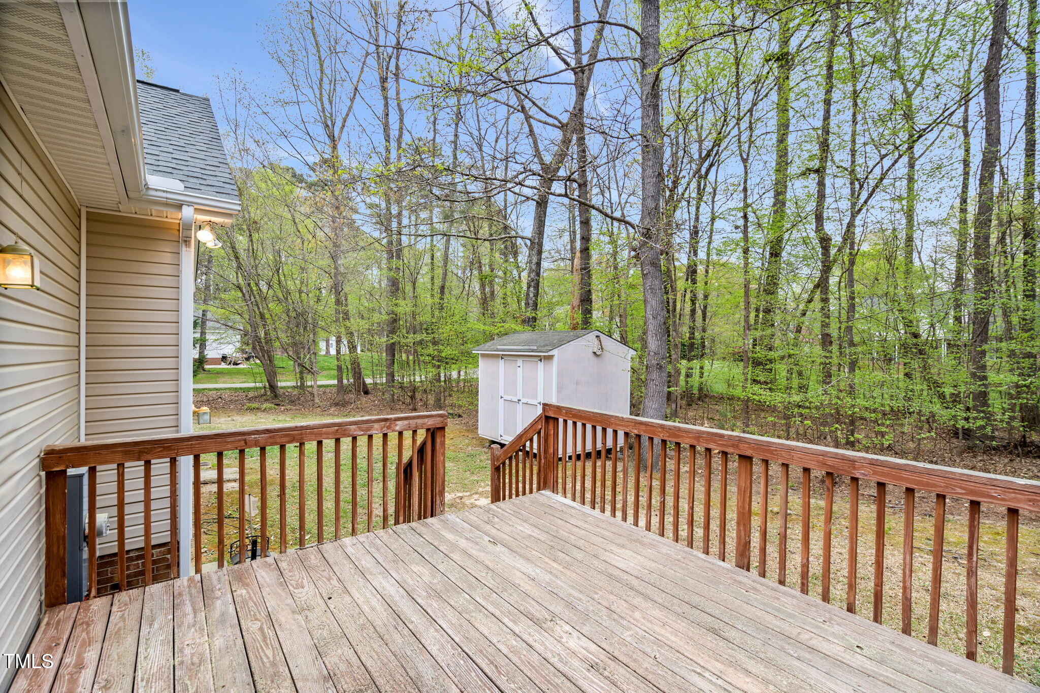 340 Castleberry Road Clayton, NC 27527 - Photo 25 of 31 a view of a wooden roof deck